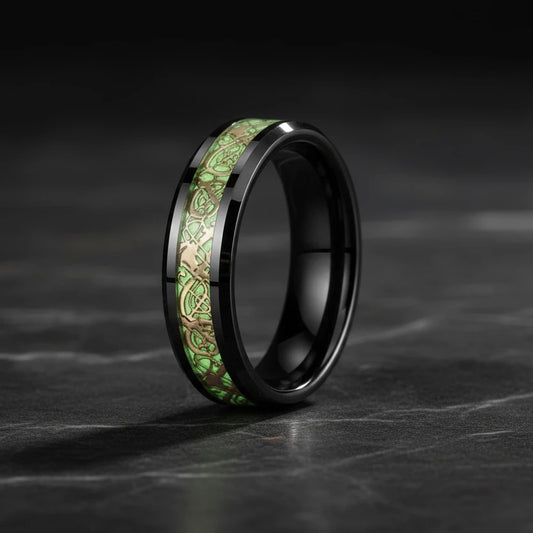 Gold Celtic Dragon Luminous Tungsten wedding ring with glowing green Celtic knot inlay on a black band.