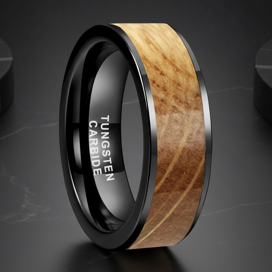 Tungsten carbide ring with wooden inlay on a dark surface
