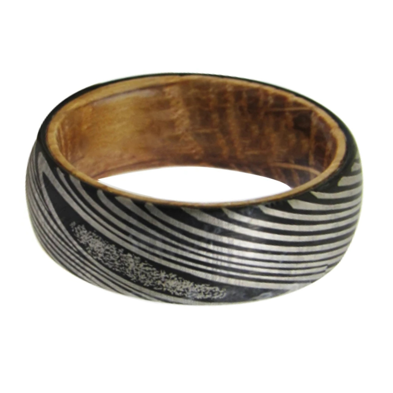 Wooden bangle with black and white striped pattern